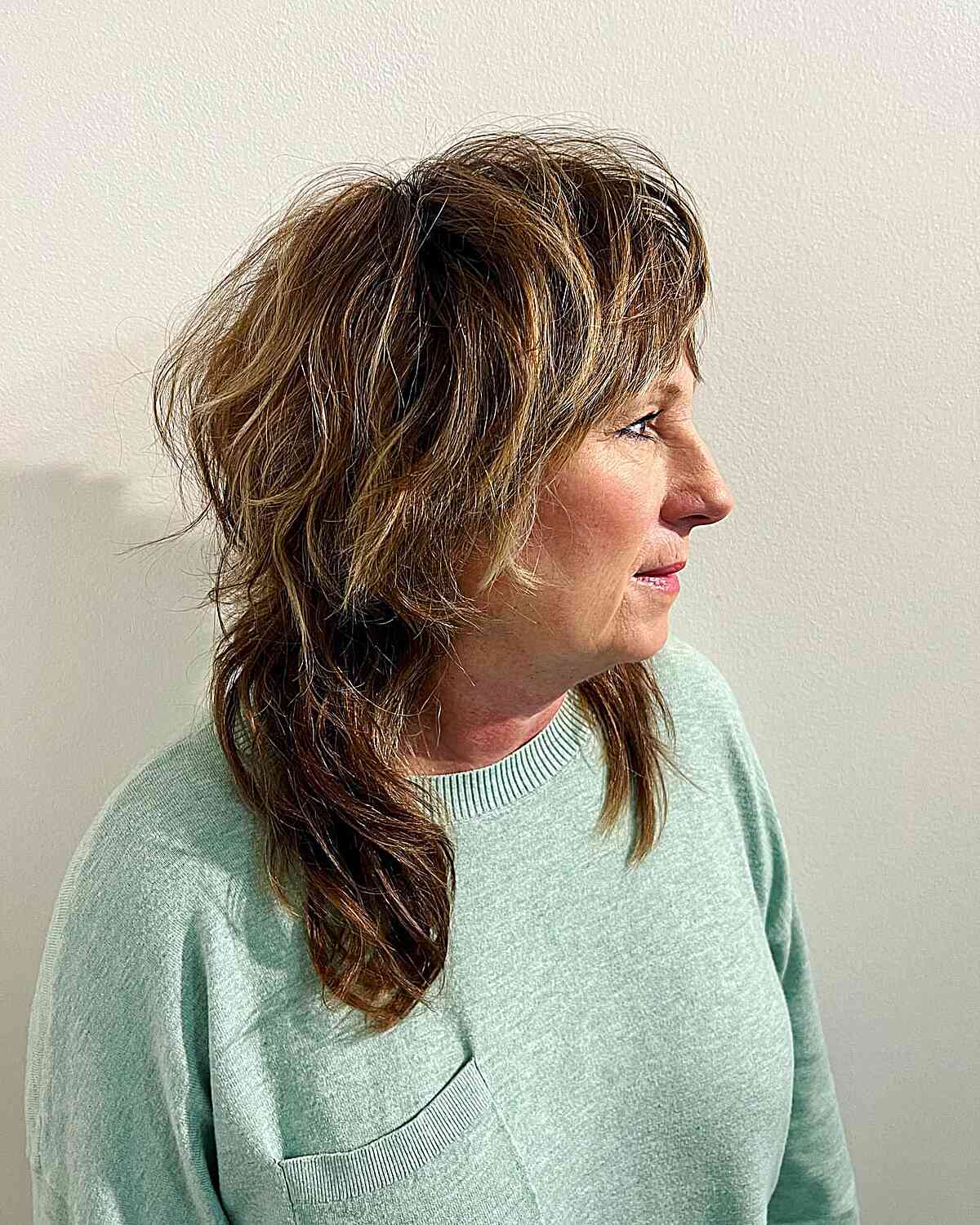 Collarbone-Length Shaggy Layered Mullet with Heavy Bangs for Older Ladies Over Sixty