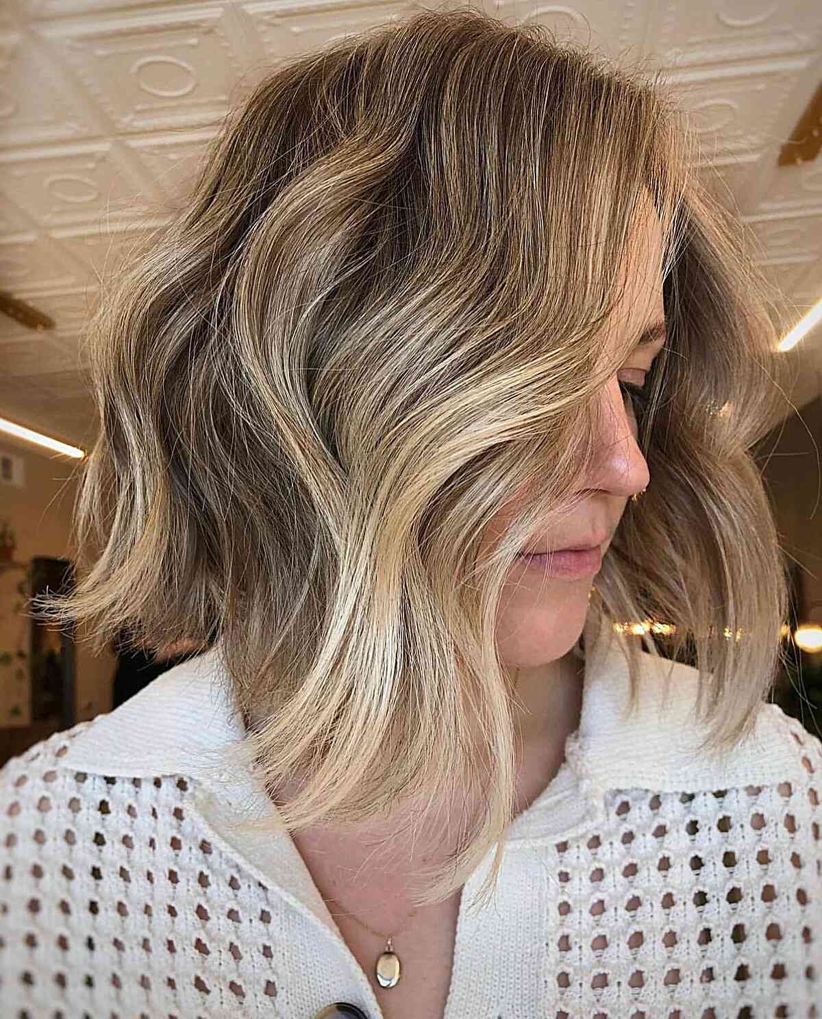 Collarbone-Length Wavy Lob with Blonde Balayage Babylights