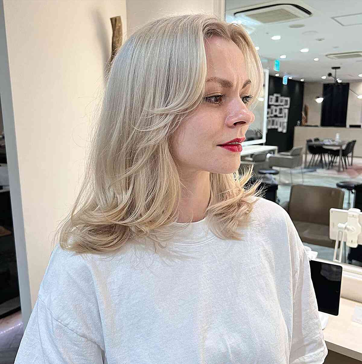 Collarbone-Length White Blonde Hair with Subtle Feathered Layers