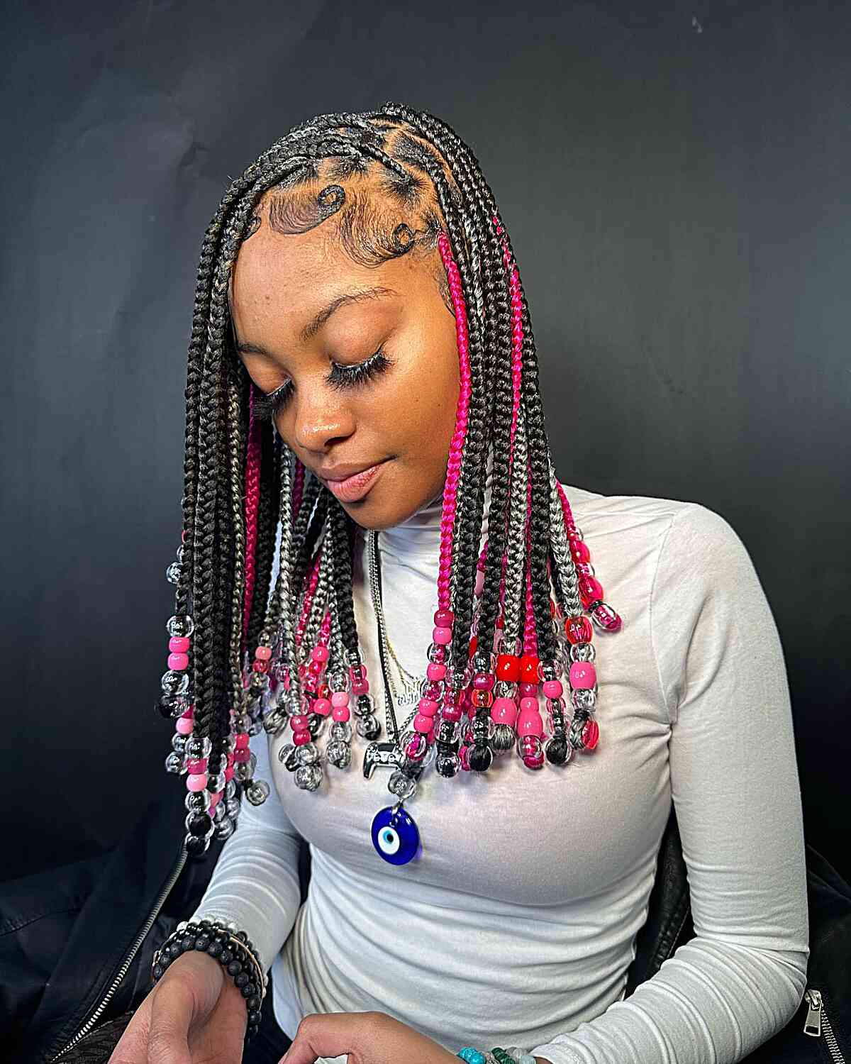 Mid-Length Colored Knotless Braids and Beads with Sleek Edges