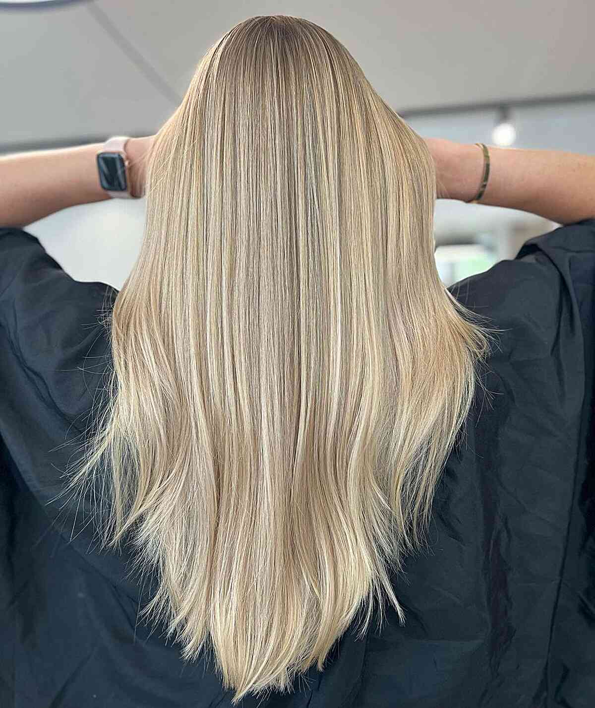 Cool Blonde Balayage Hue with Long Straight V-Shaped Cut and Subtle Layers