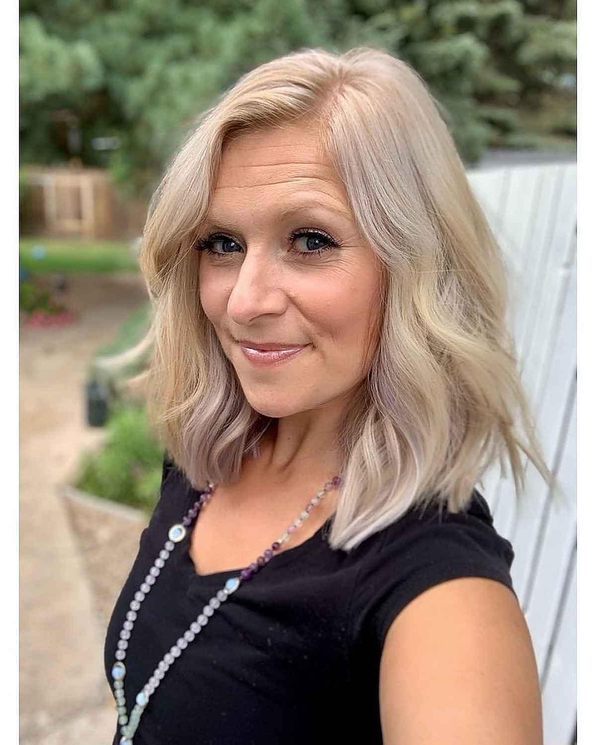 cool and soft blonde highlights hairstyle for ladies over 50