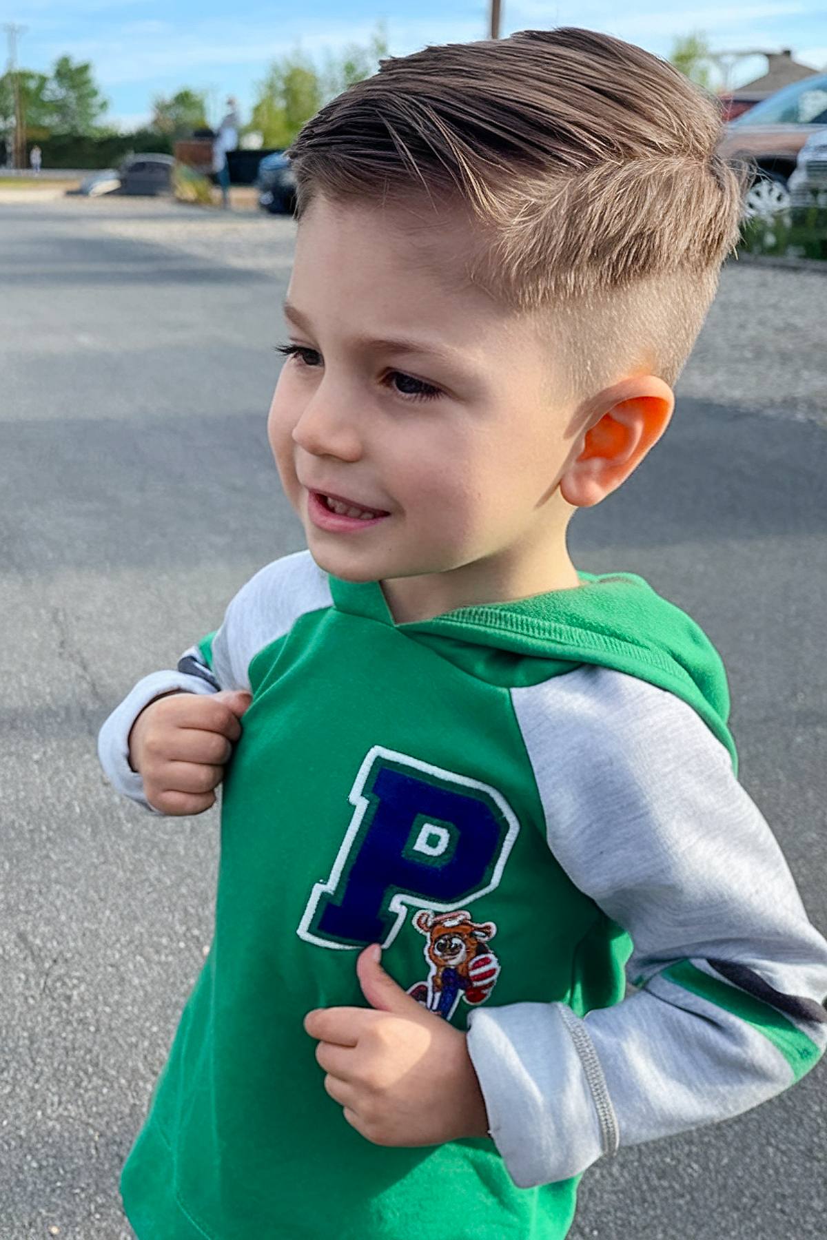 Toddler boy undercut hairstyle with longer top and shaved sides