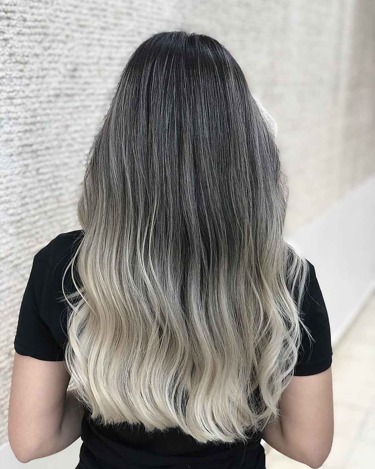 Cool-toned blonde ombre on dark hair