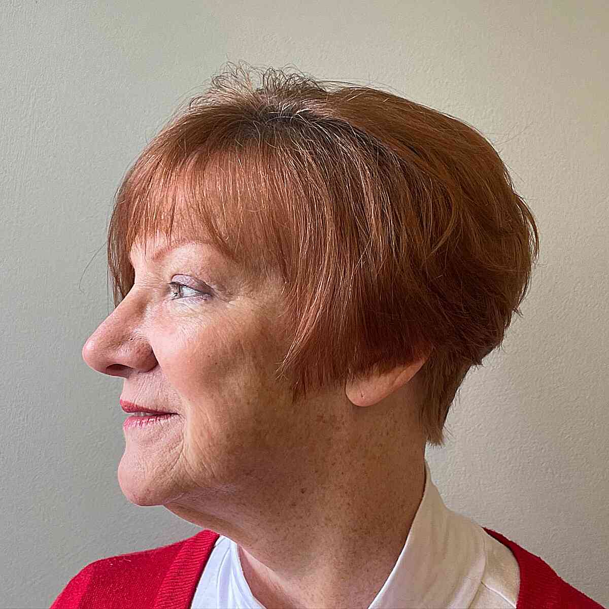 Copper Bixie Hair with Wispy Bangs for older ladies over seventy