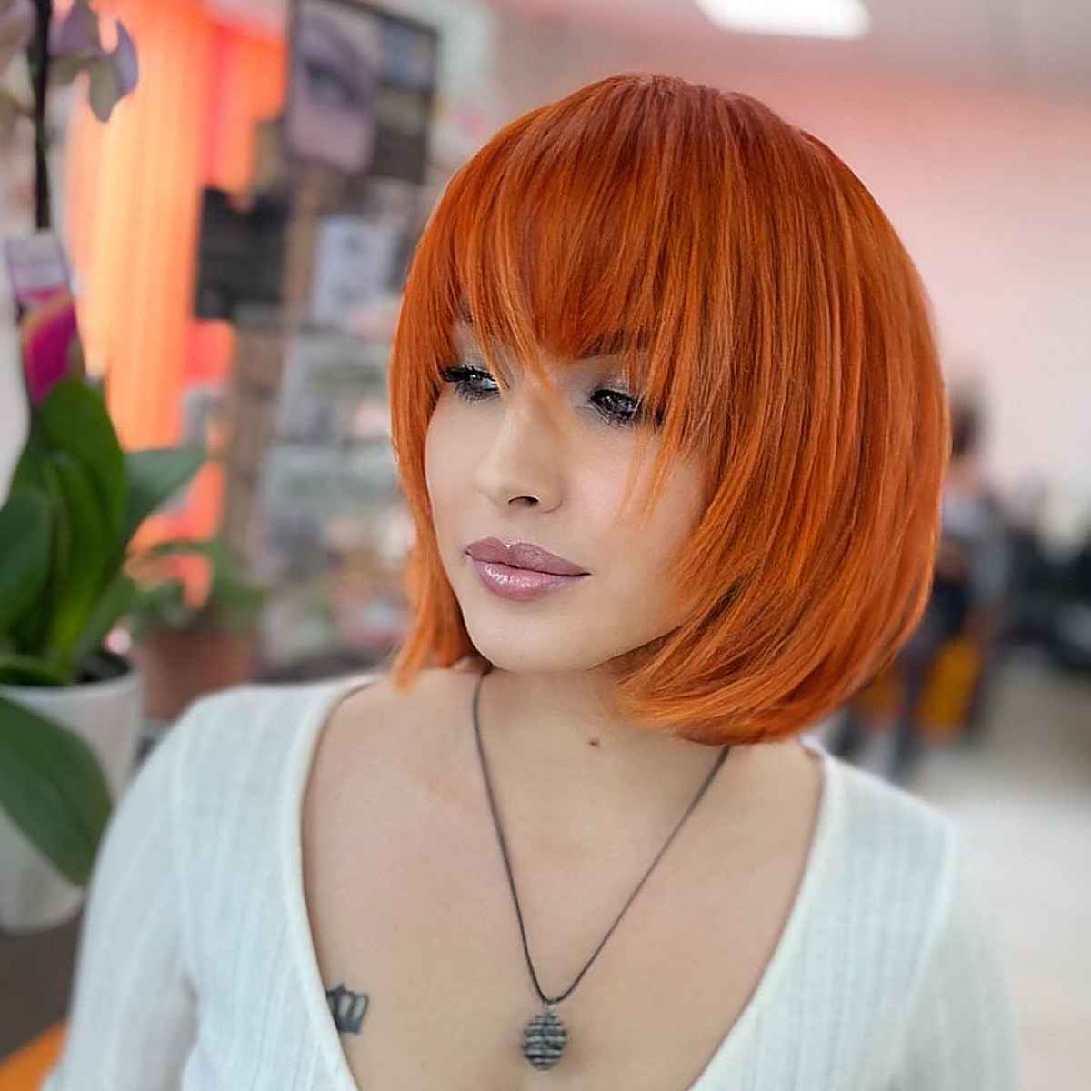 copper hair color for a bob with bangs