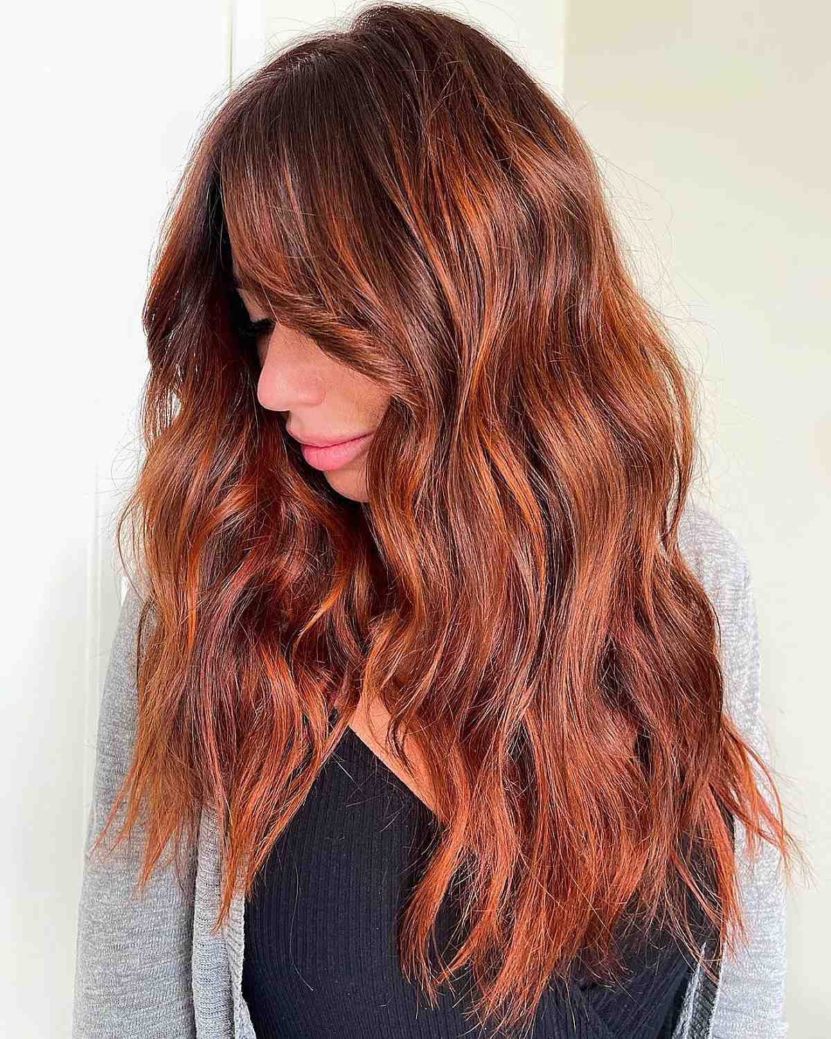 Touchable copper highlights on brown hair