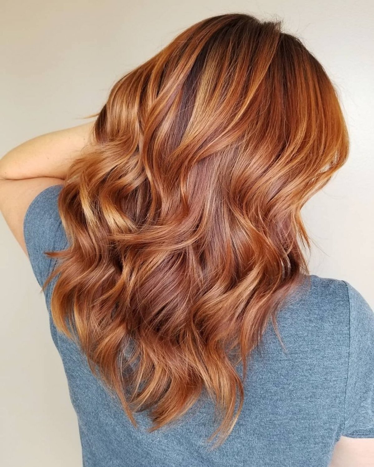 Layered Copper Red Hair Color With Rose Gold Highlights