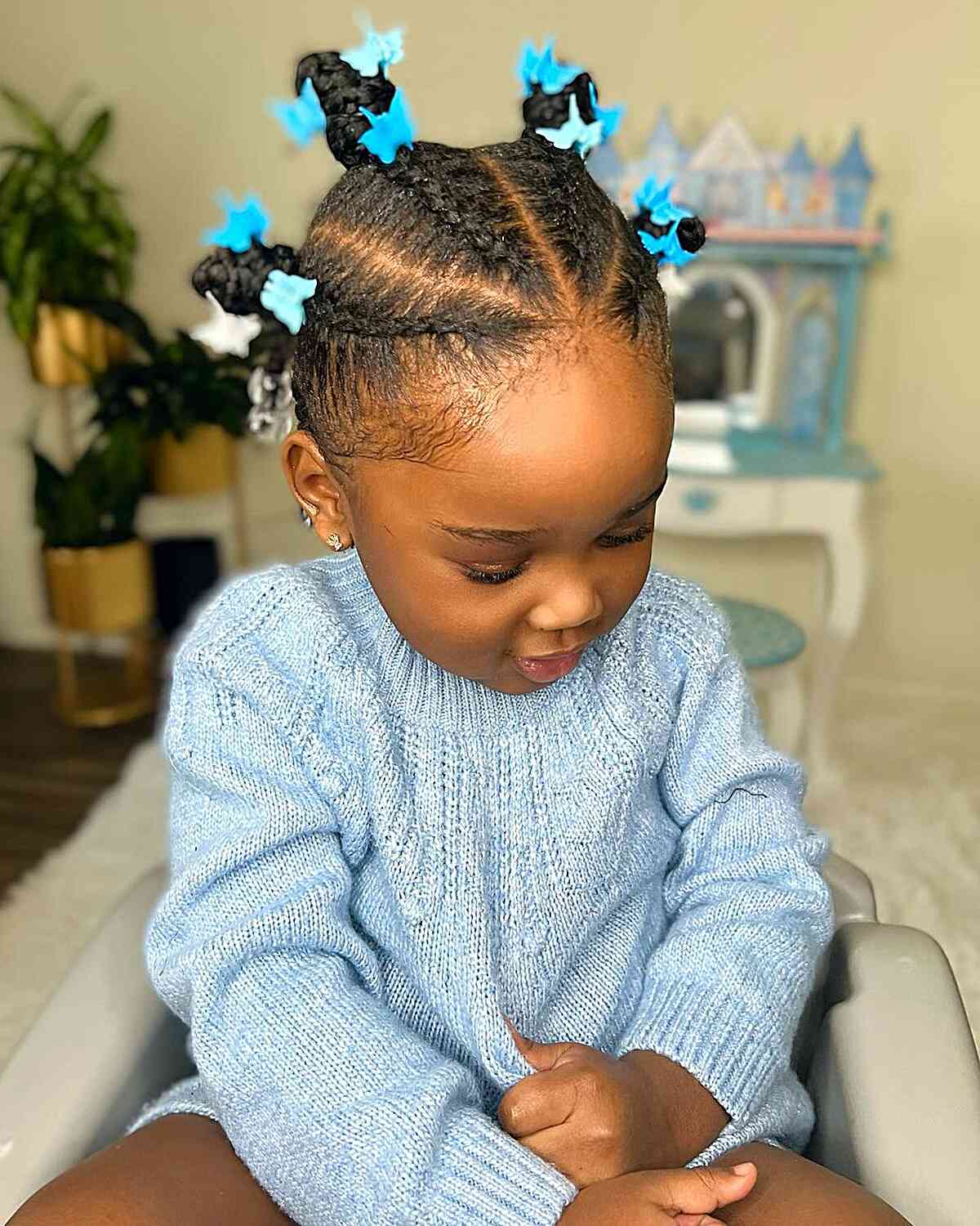 Cornrows and Mini Buns with Butterfly Clips for Young Black Toddlers