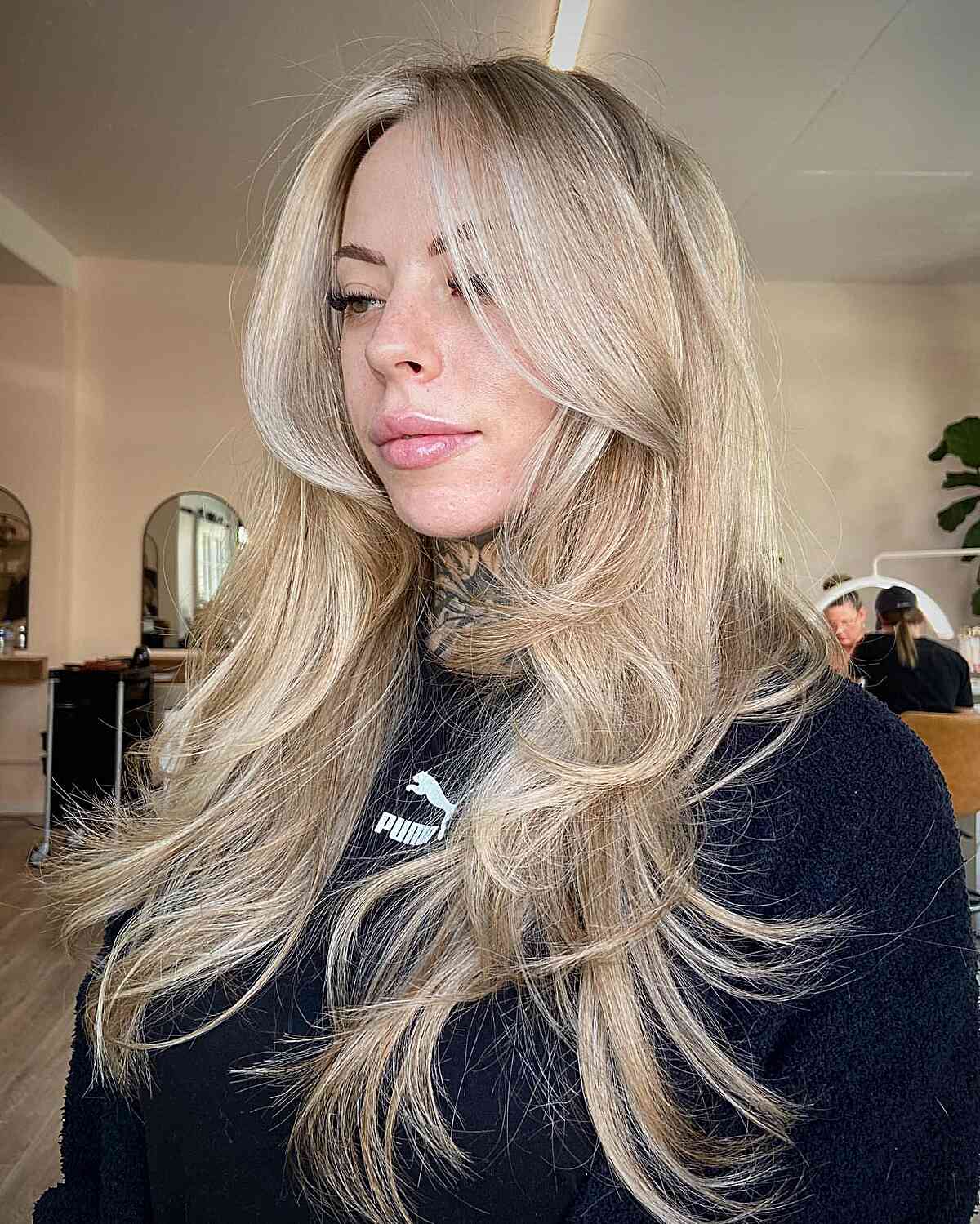 Creamy Blonde Hair with Long Feathered Butterfly Cut