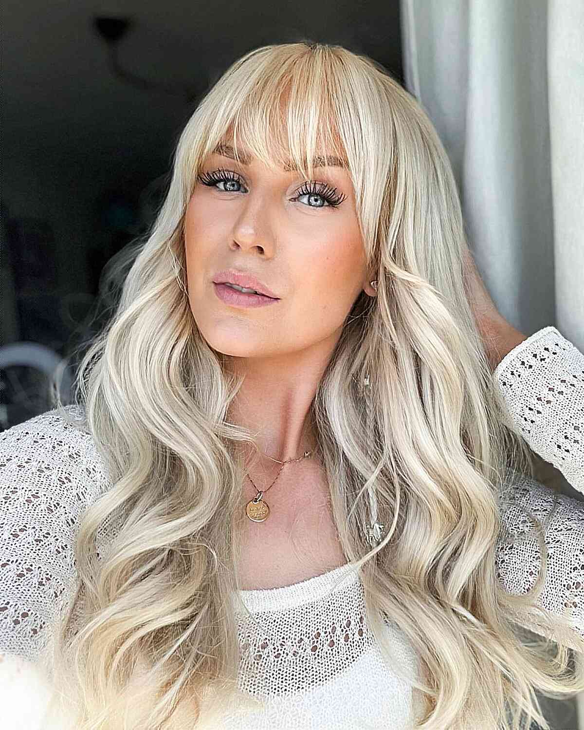 Creamy Blonde Long Waves and Soft Waterfall Fringe