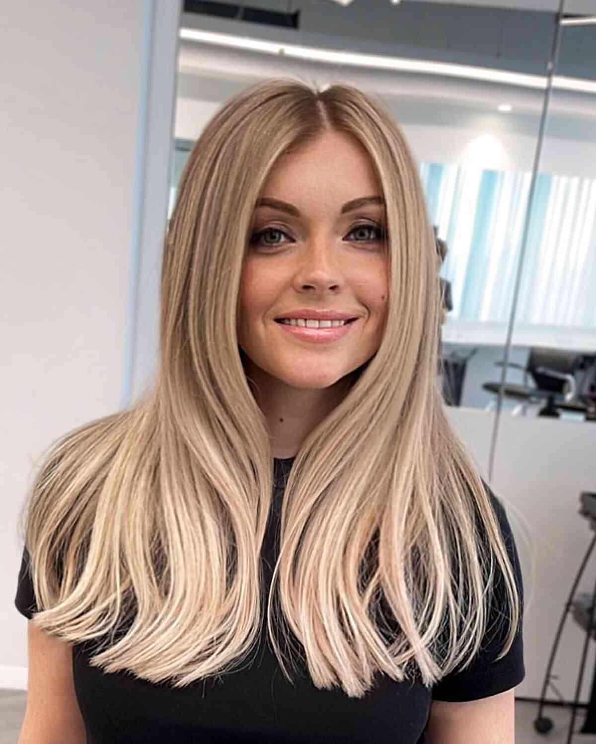Creamy Blonde Middle-Parted Hair on women with long hair and blunt ends