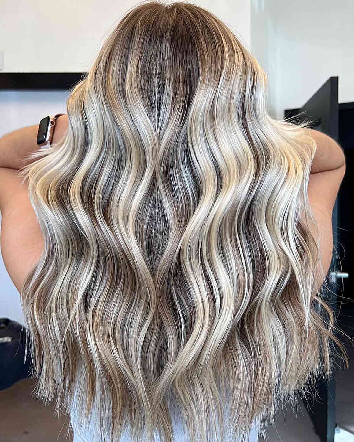 Creamy Icy Blonde Balayage Highlights on Long Light Brown Hair with Choppy Ends