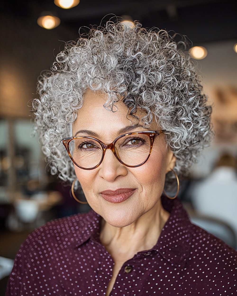 Cropped curls for women over 60 with natural gray definition