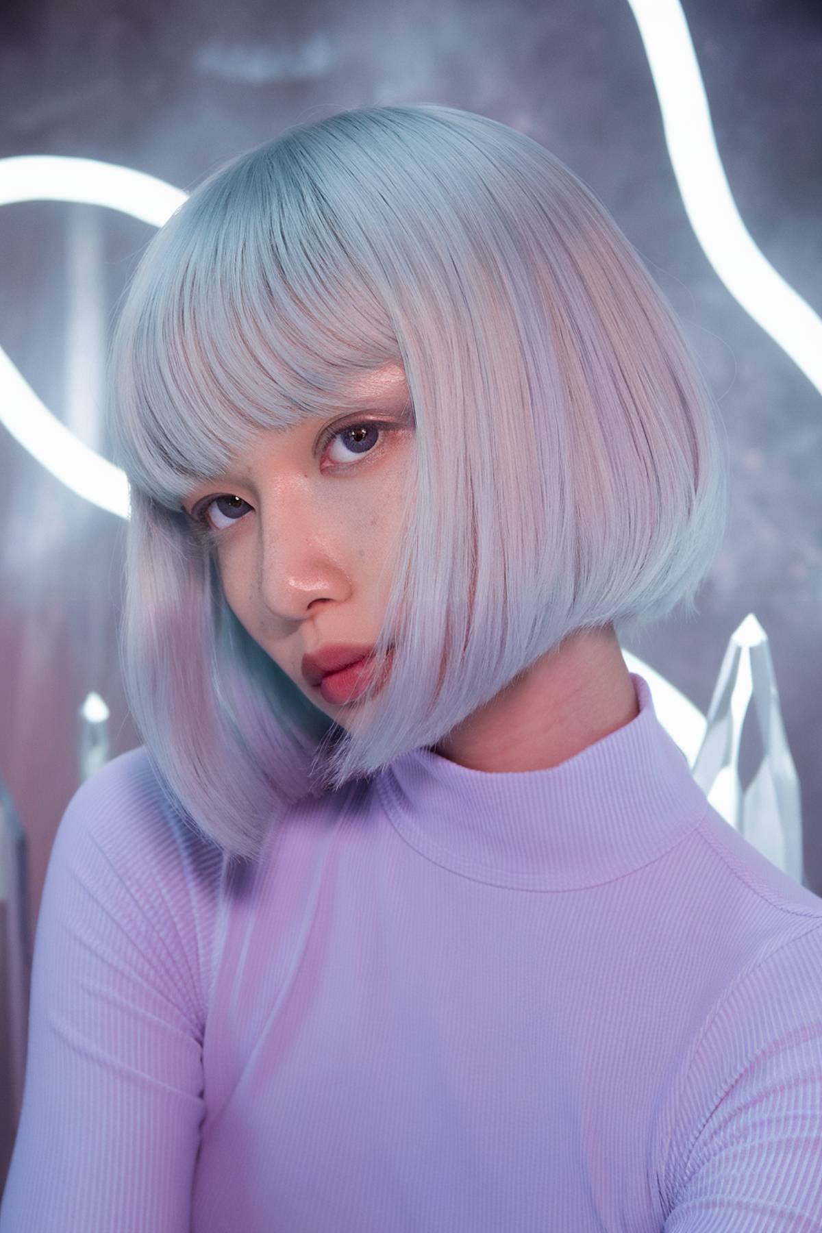 Ultra-sharp crystal cut bob with a glassy platinum blonde finish and icy pastel undertones