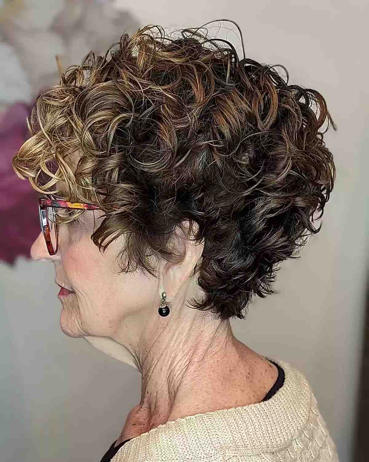 Curled Bixie Brunette with Hints of Blonde on Old Women Over 60 with Glasses