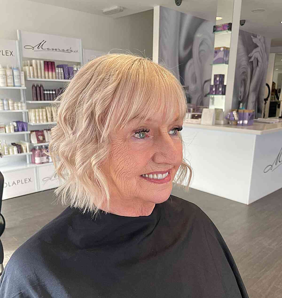 Curled Chin-Length Bob with Sleek Fringe on Woman Over 60