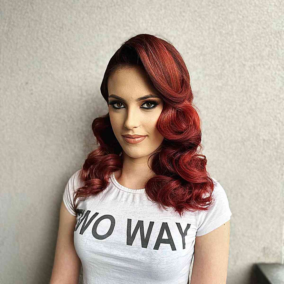 Curled Red Hair with a Deep Side Part for bold women