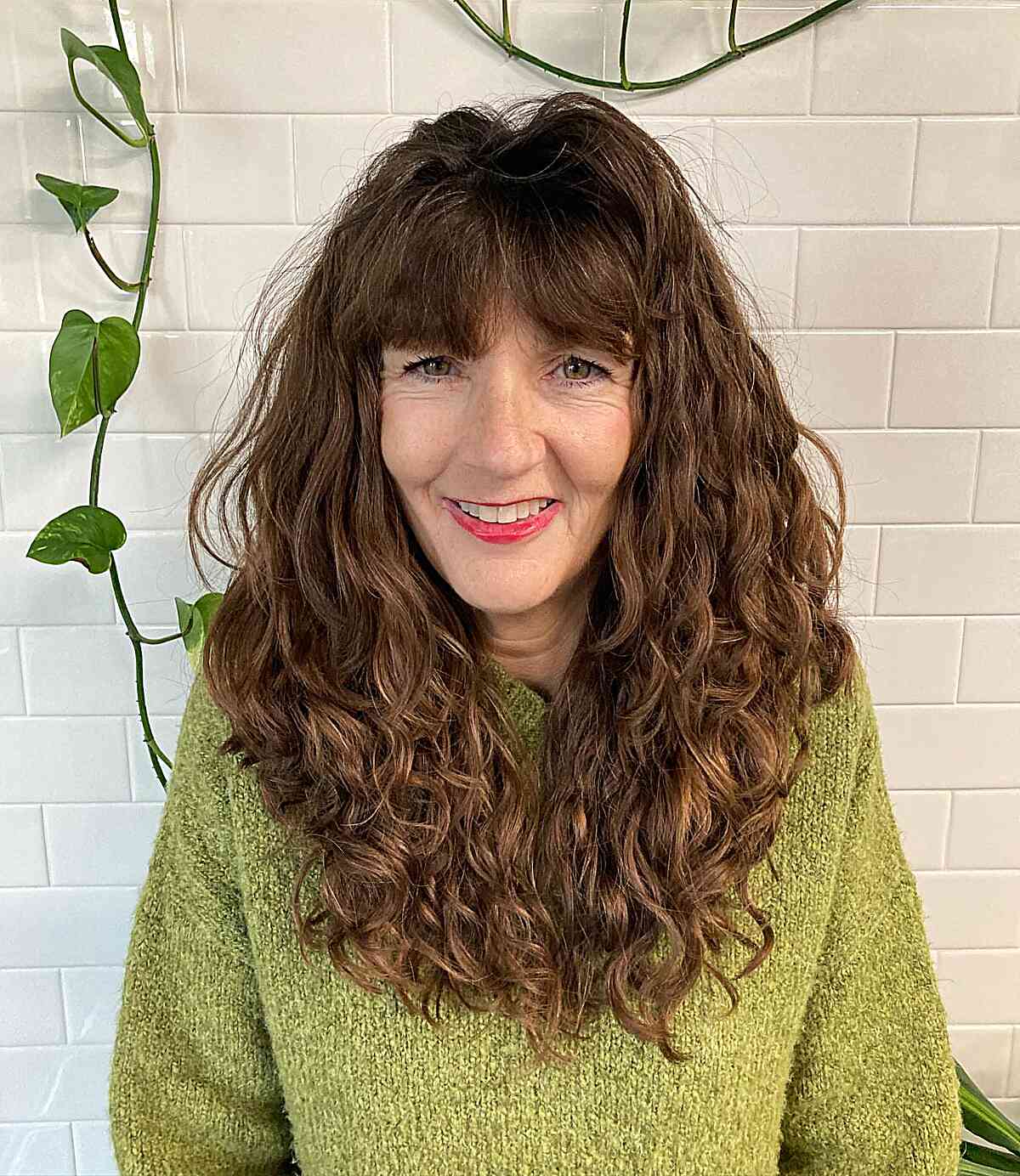 Curled V-Cut Long Hair with Fringe for a 60-year-old