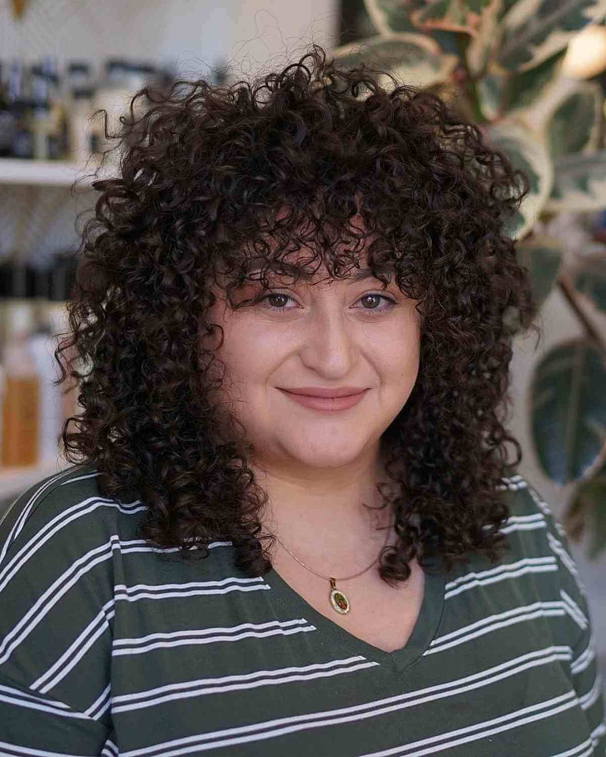 Beautiful curly bangs for curly hair and round face shape