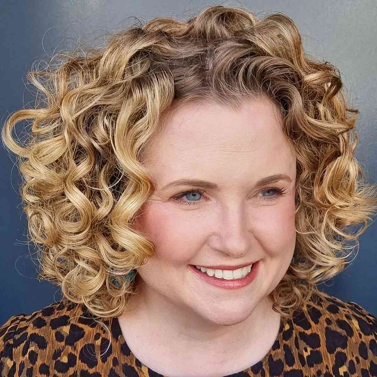 Curly Bob Hairstyle for Ladies Over Fifty with Round Face Shapes