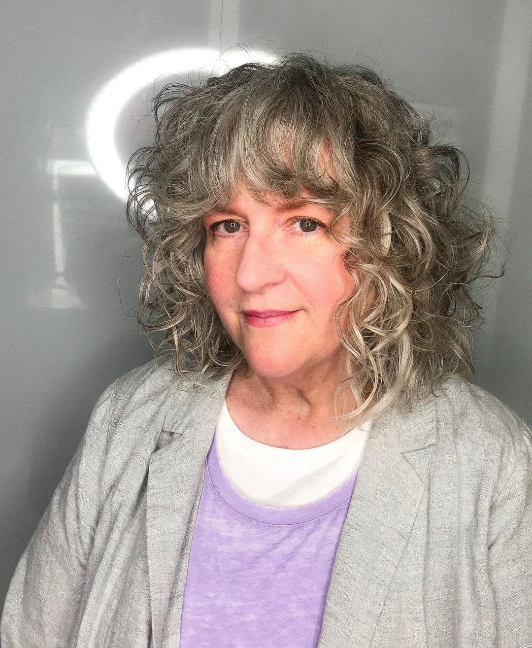 Curly Bob with Bangs for Over 50 with Thin Hair
