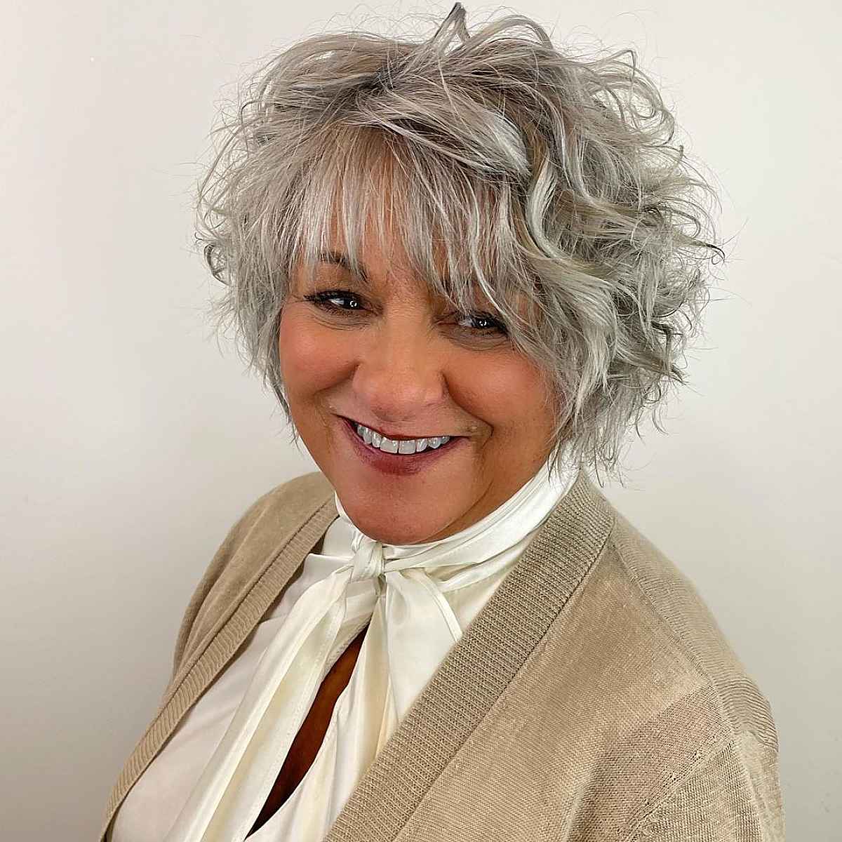 curly bob with straight bangs for women over 60