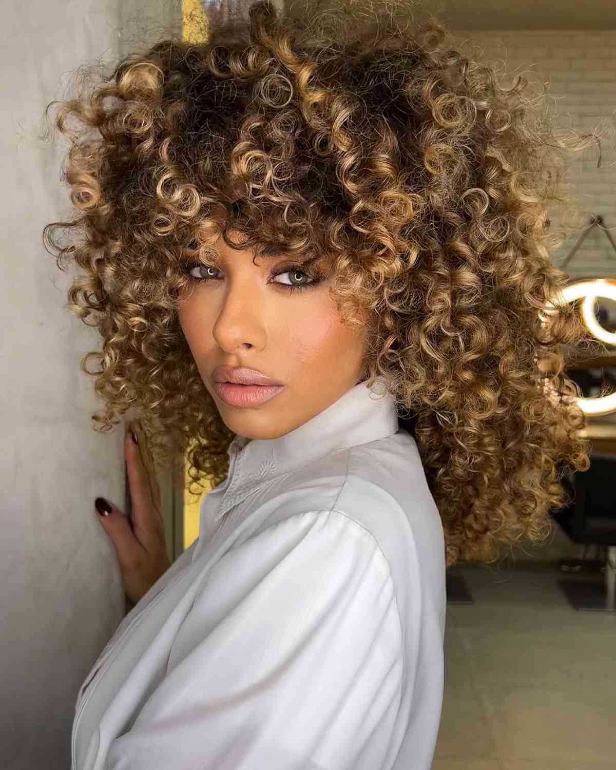 Full-Looking Brown Curly Hair with Golden Highlights