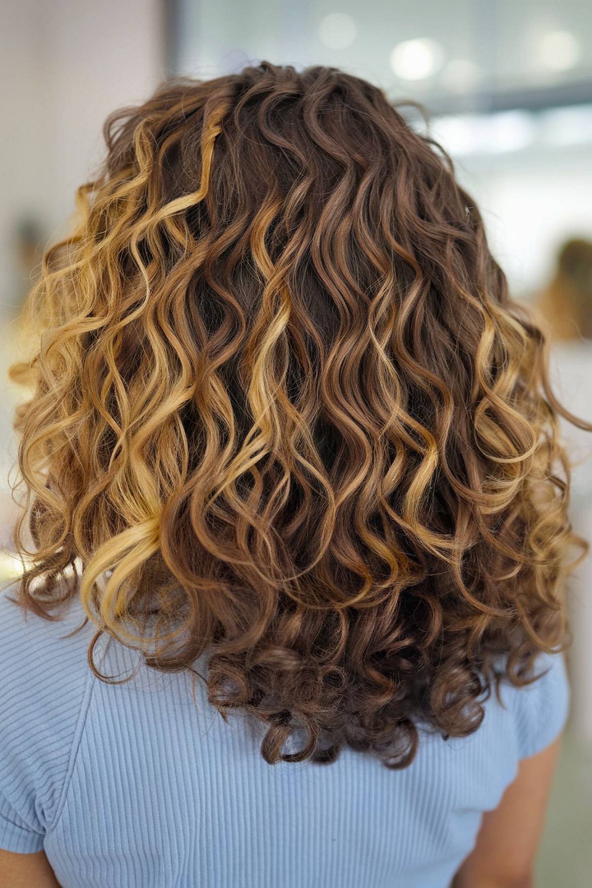 Curly brunette balayage hair