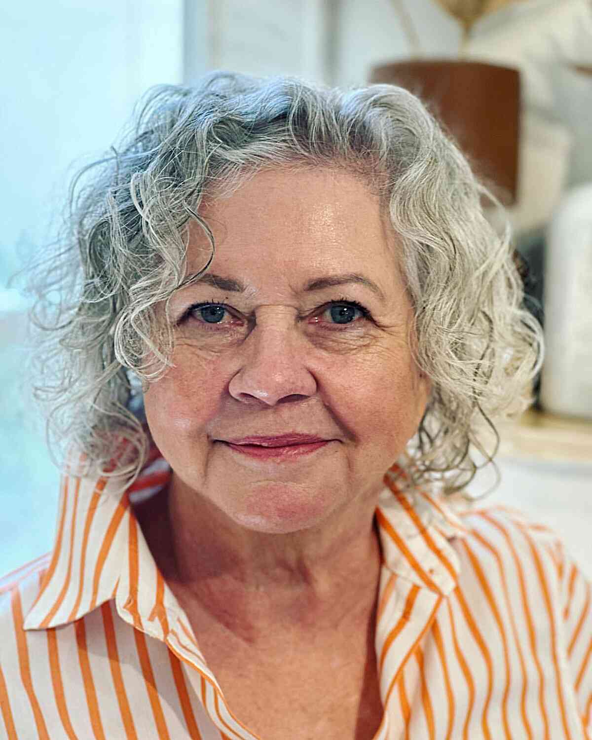Curly Chin-Length Bob on Older Women's Grey Hair
