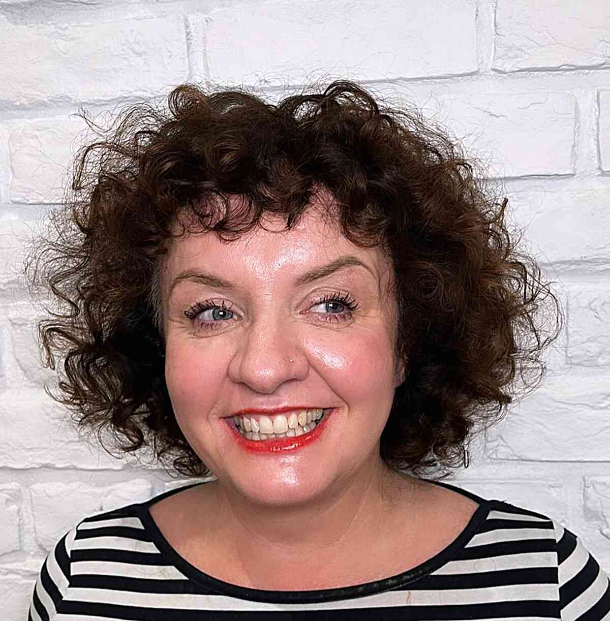 Curly Fringe on a Curly Short Bob Cut for Ladies over 60 with frizzy hair