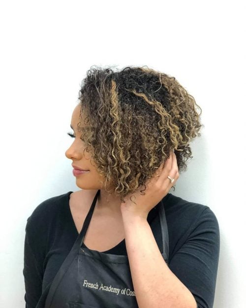 Trendy curly short hair with highlights