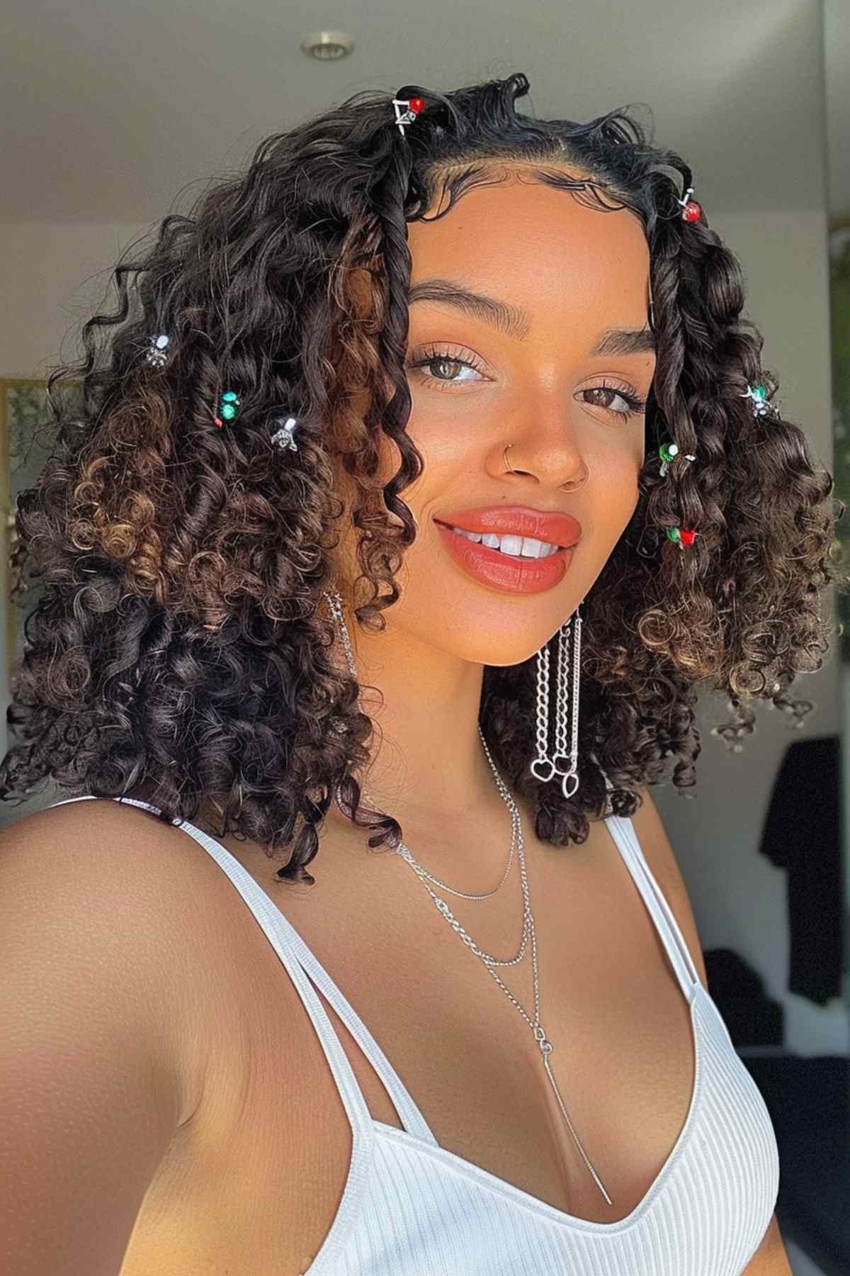 Curly hairstyles with hair charms adding color and flair to defined curls