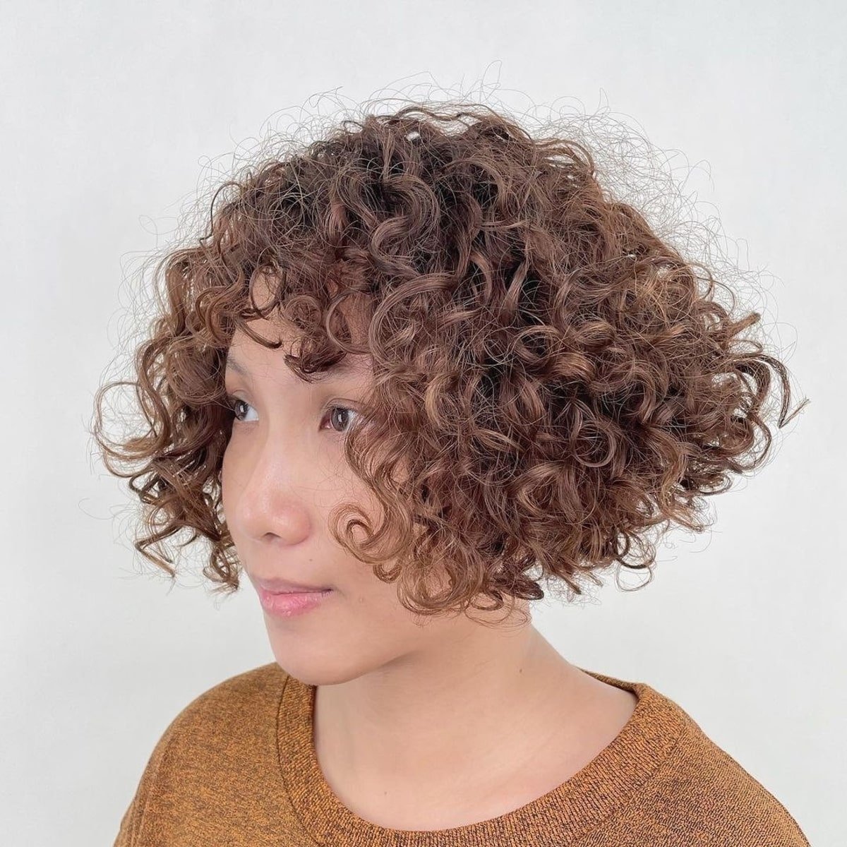 Curly inverted bob with fringe