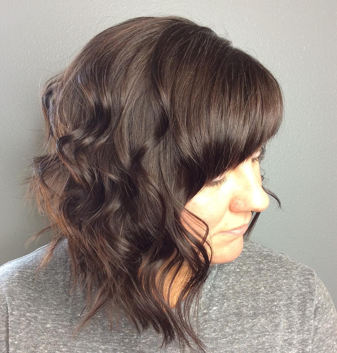 curly inverted bob with straight bangs