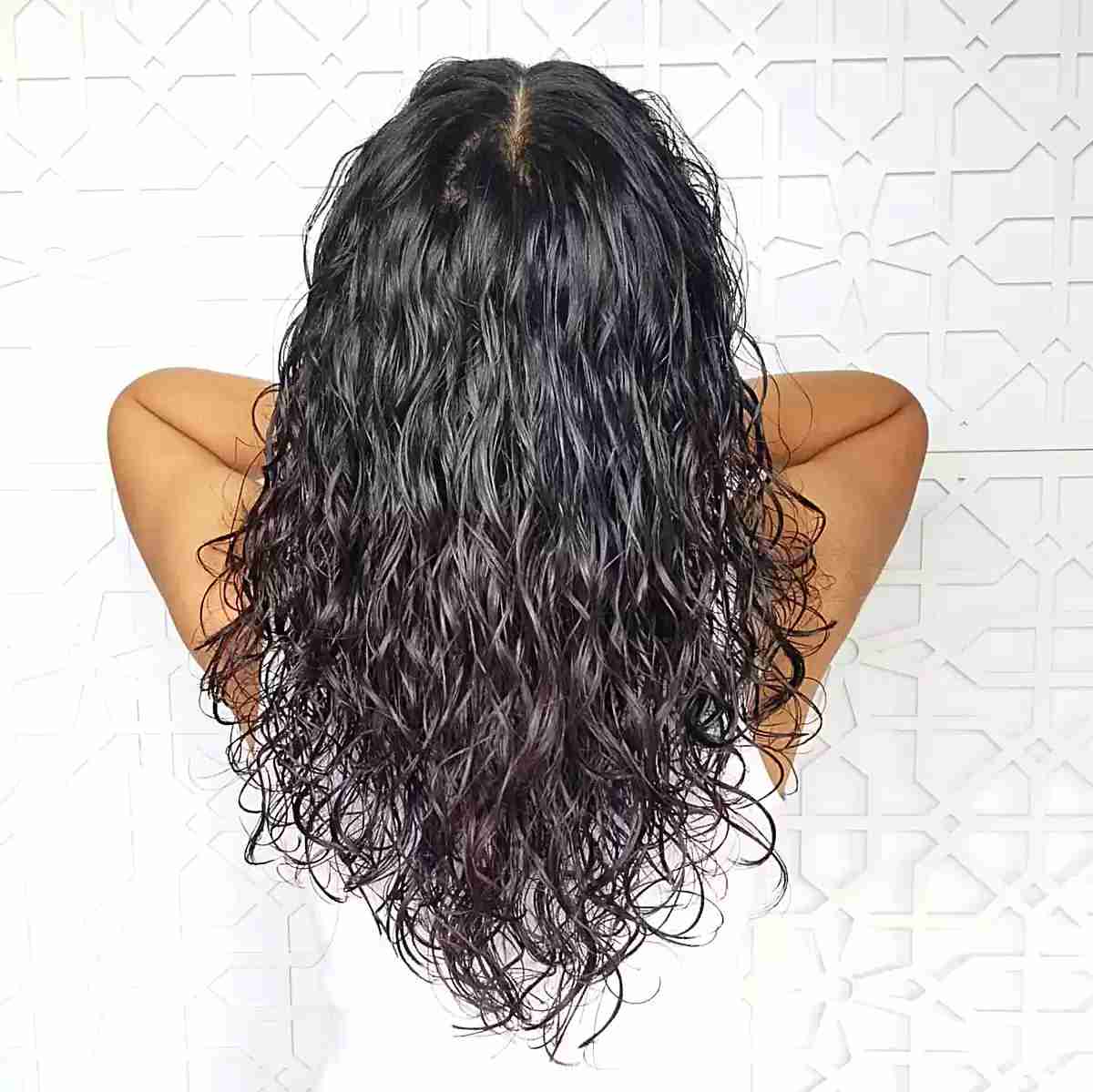 Curly Layered V-Cut with a Middle Part on Black-Haired Ladies