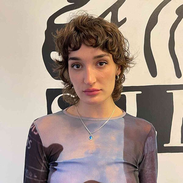A Curly Mini Pixie Shag with Short Bangs