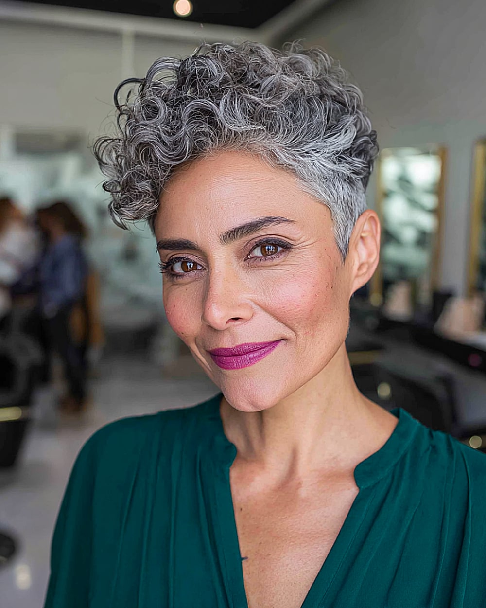 Curly pixie cut with gray coils and crown lift for mature women with thick textured hair