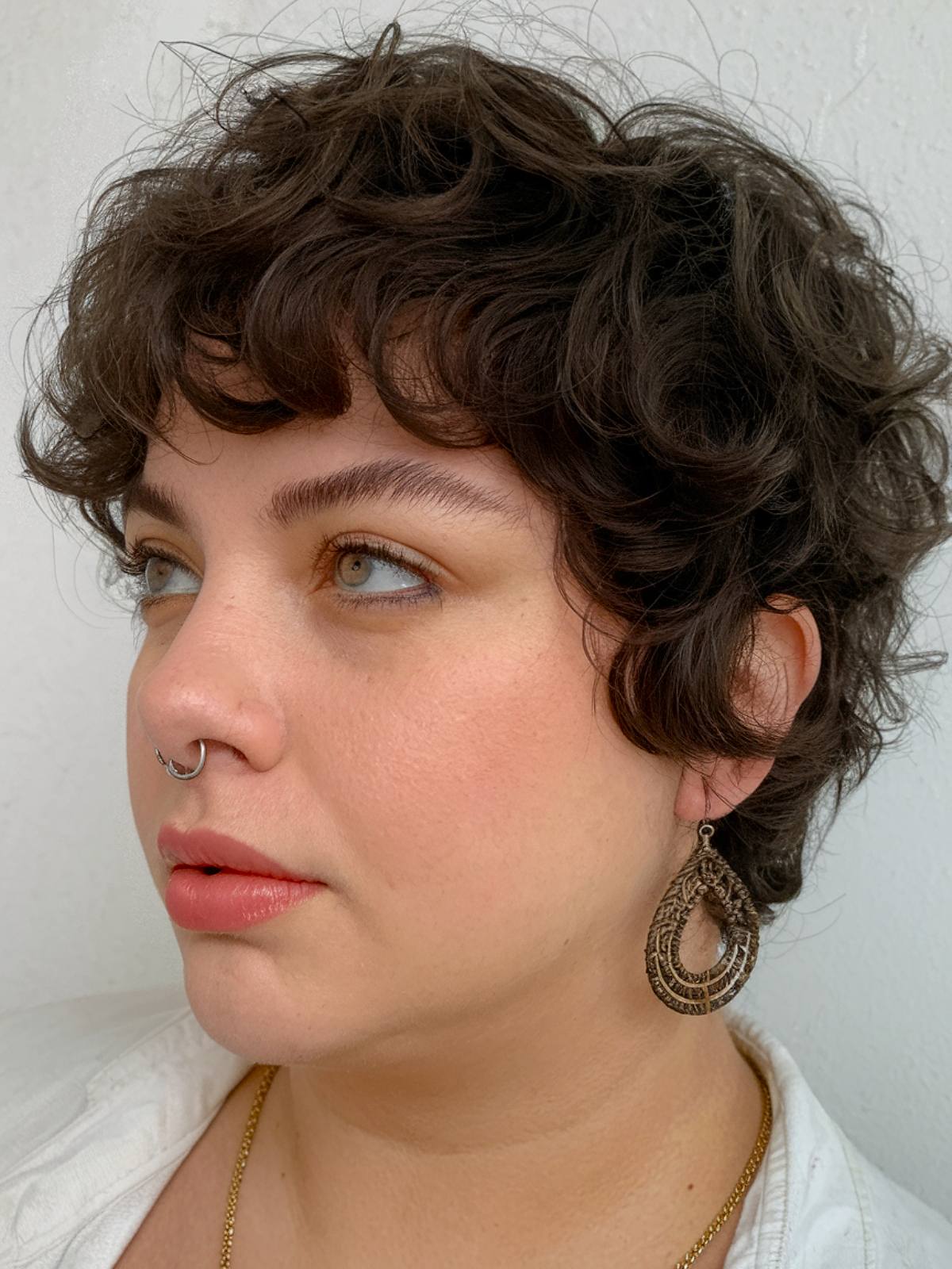 Curly pixie haircut for plus size women with natural curls