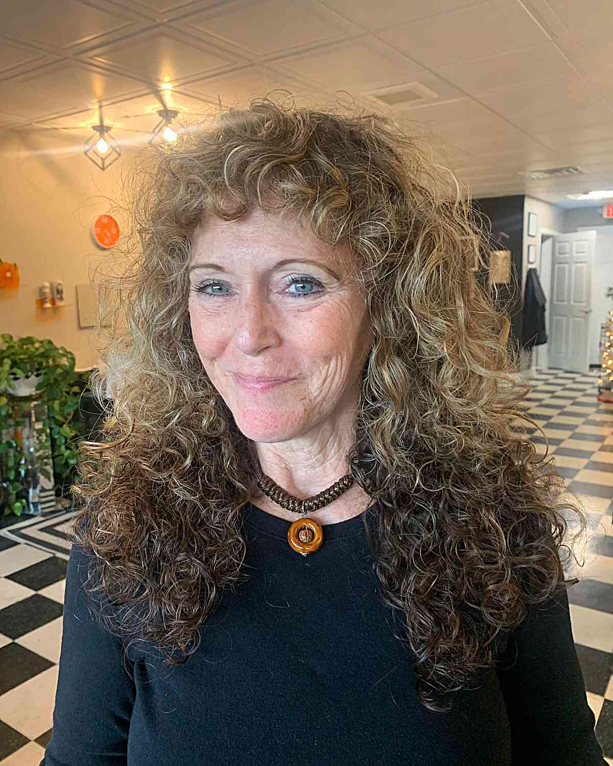 Curly Shag with Long Layers and Short Bangs on ladies in their 60s