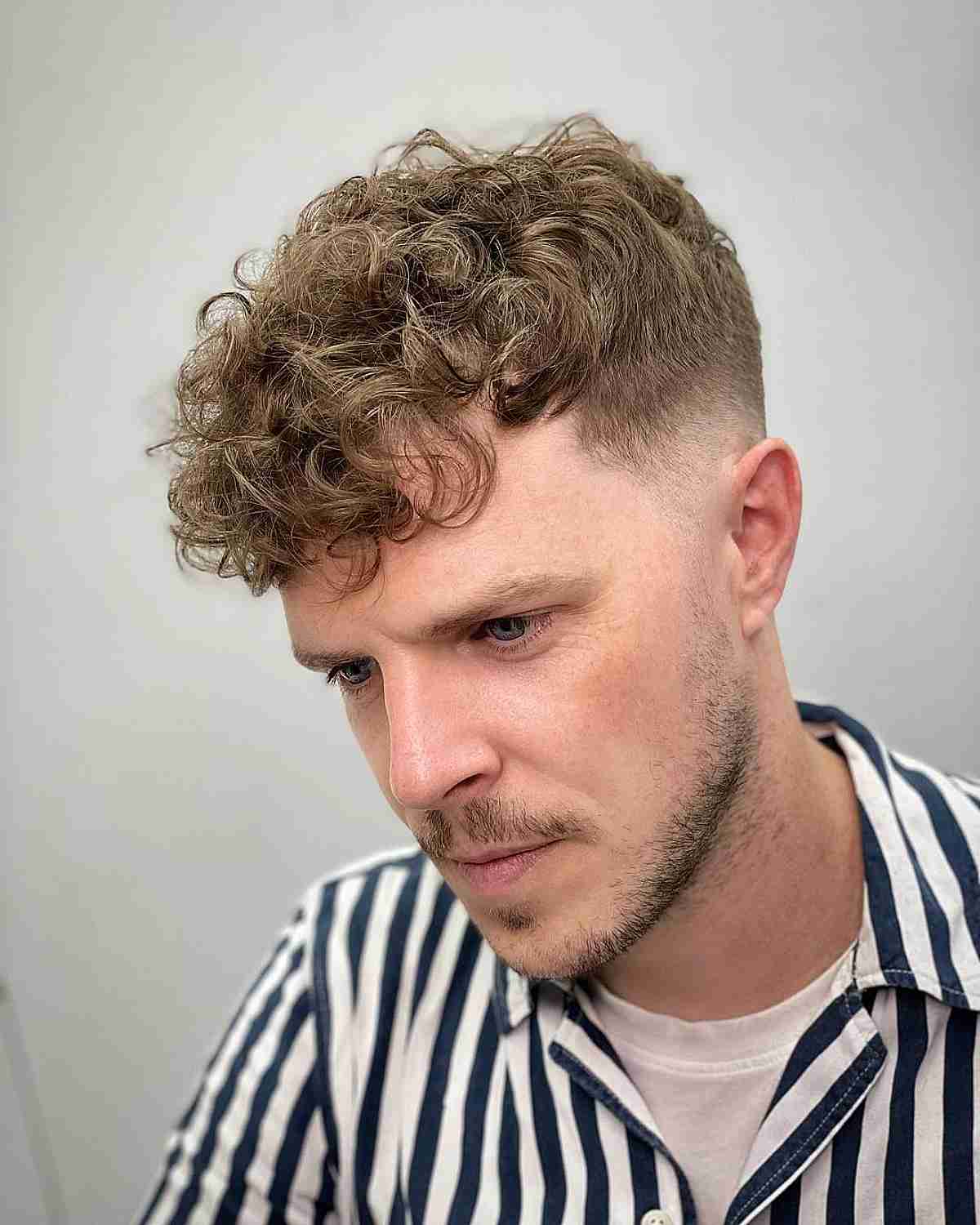 Curly Tousled Top with Short Sides for Men