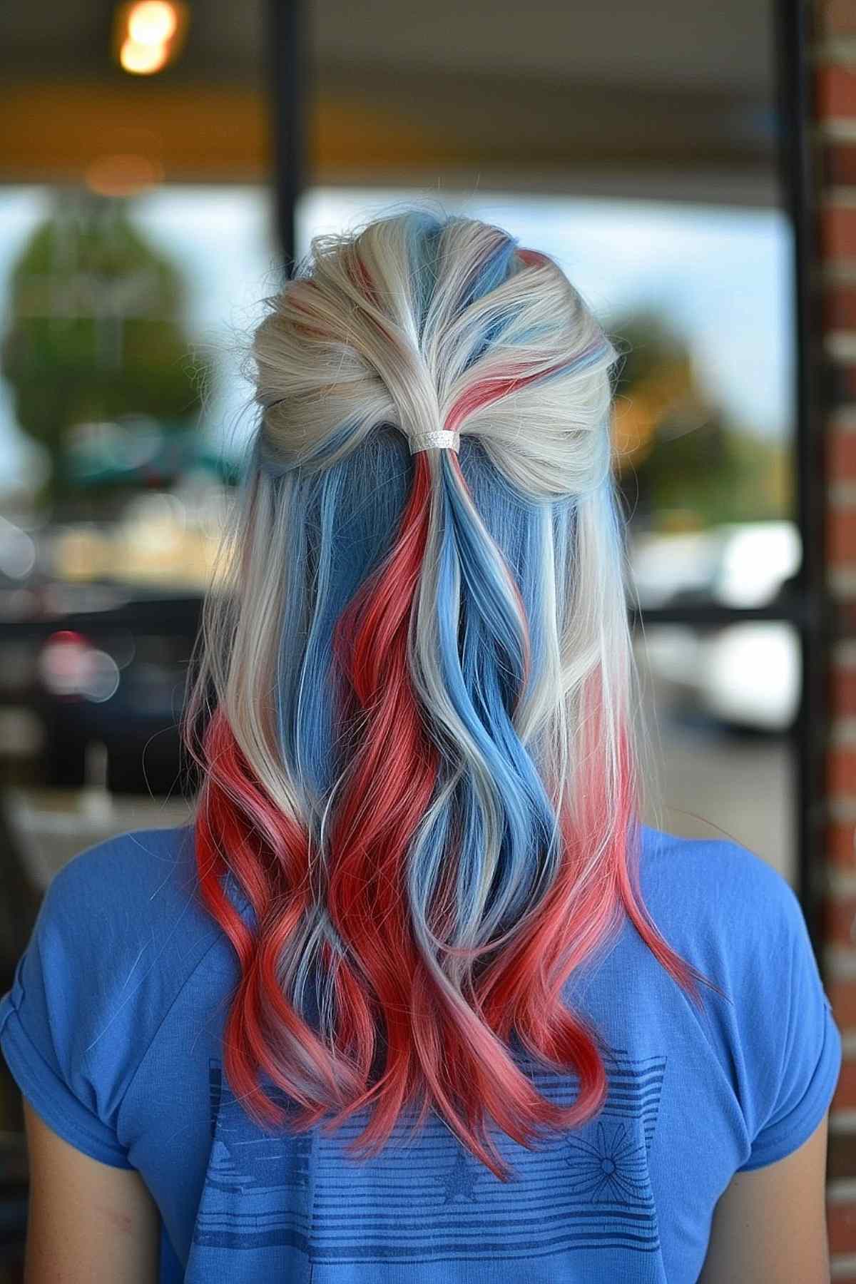 Half-up, half-down hairstyle with red and blue highlights for teens on 4th of July