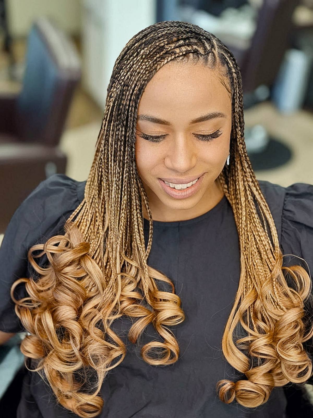 Long-length box braids with caramel French curls