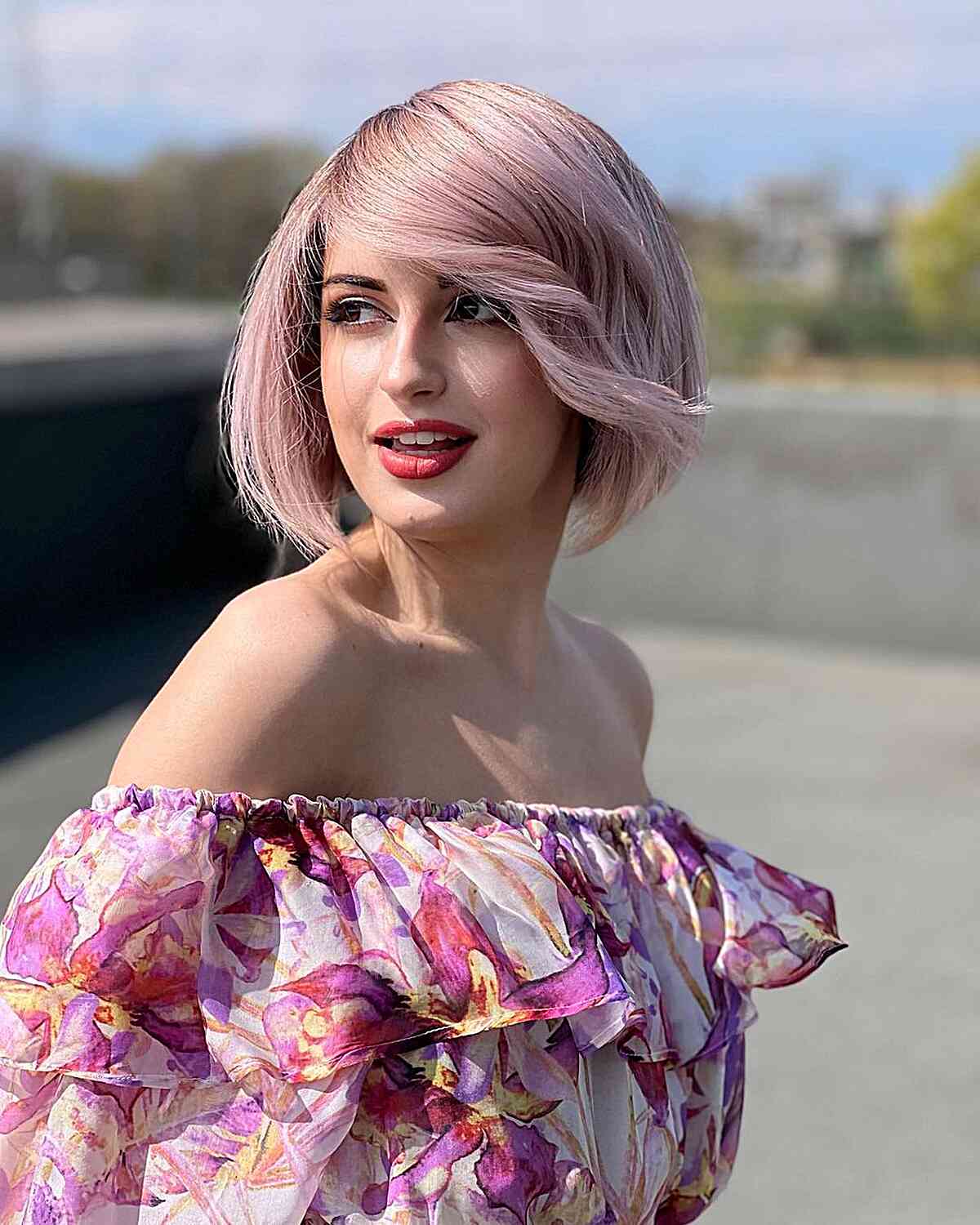 Cute Pink Bob with a Deep Side Part on women with bold makeup 