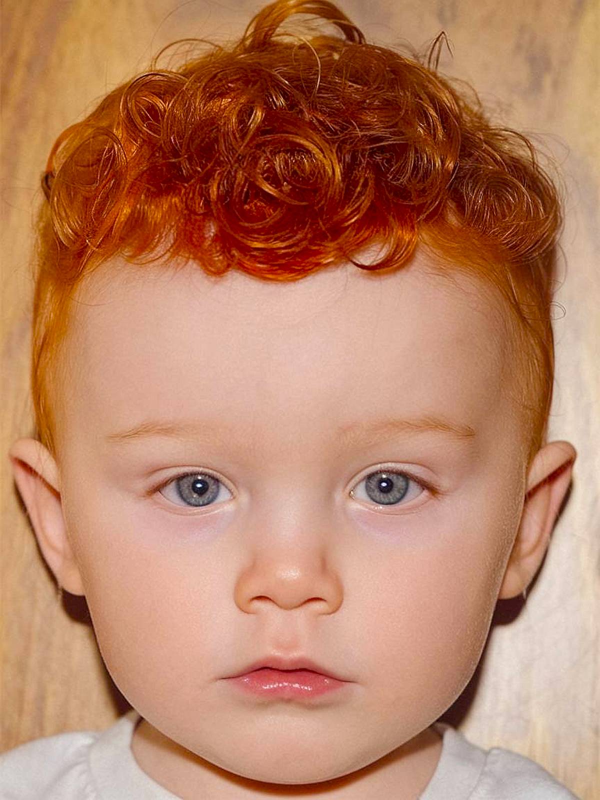 Toddler boy haircut for red hair with short curls on top