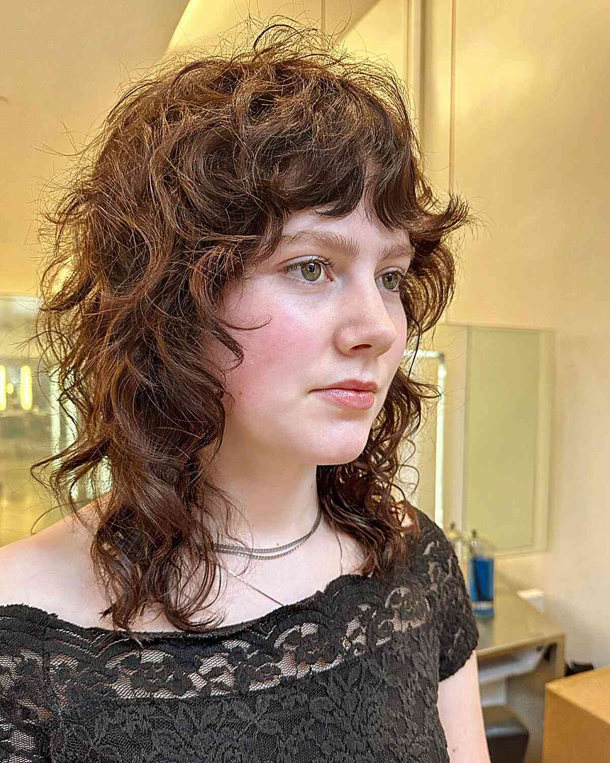 Cute Shaggy Wolf Cut for Curly Hair for ladies with an oval face
