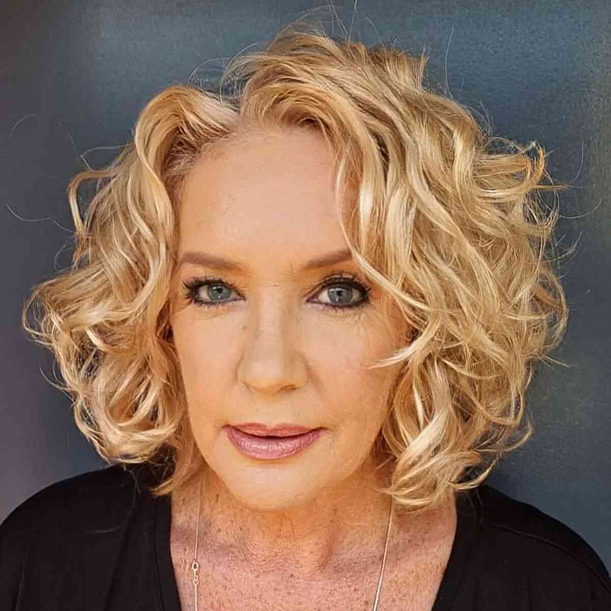 Cute short golden balayage wavy bob for older women over 60 and up