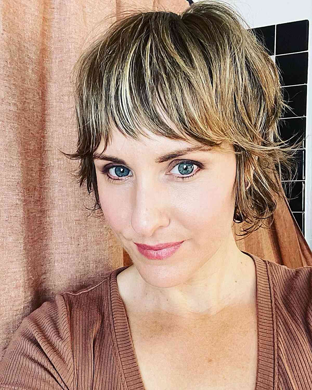 Cute Wixie Cut with Blonde Highlights