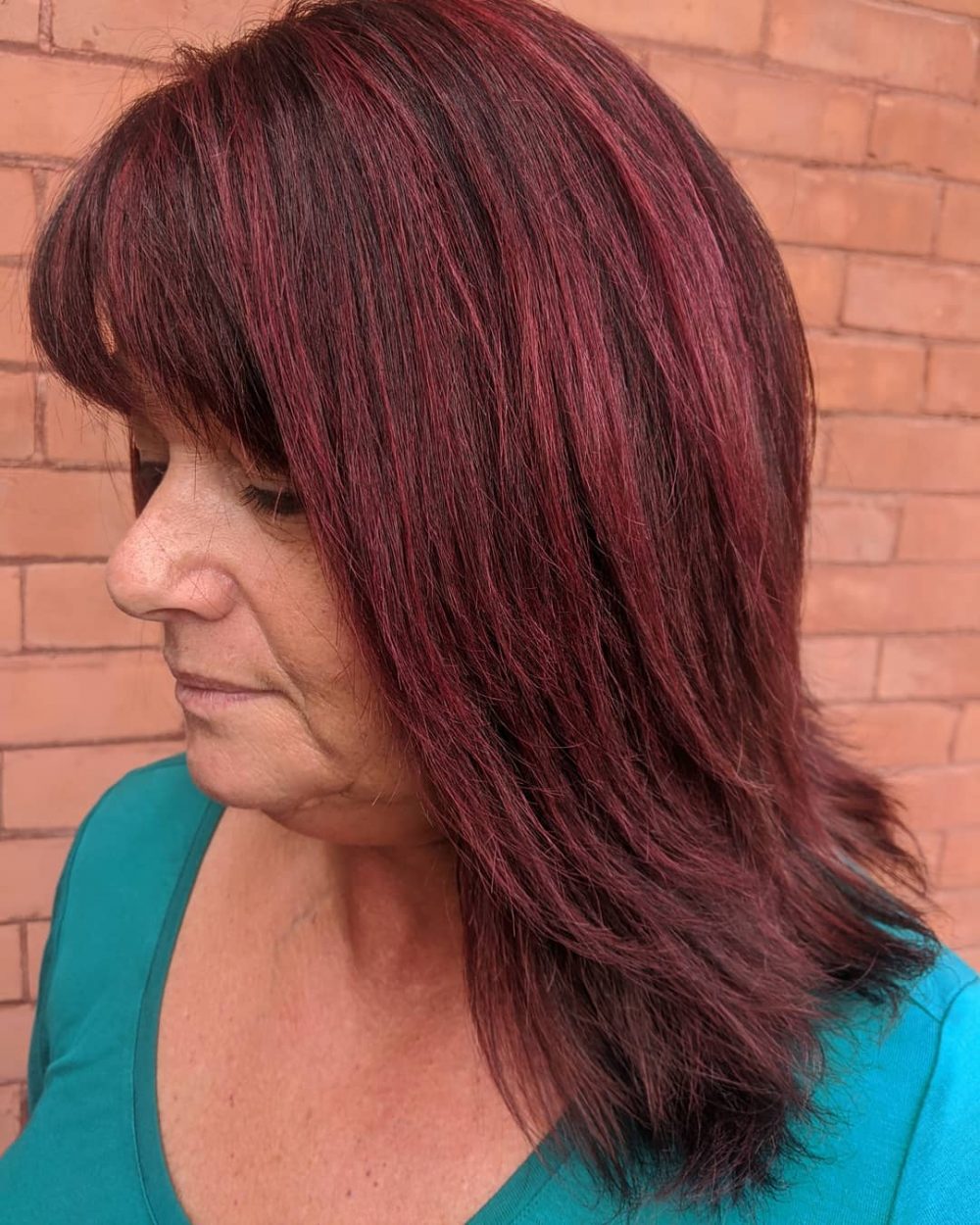 dark and vibrant burgundy Balayage on Straight Hair for ladies over 50