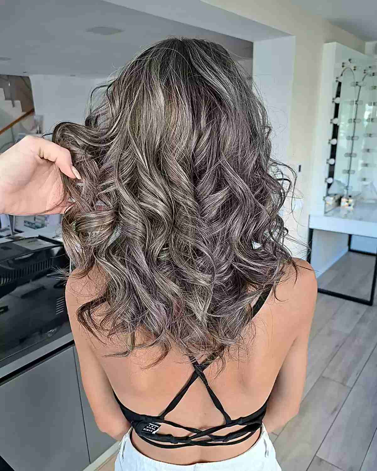 Mid-Long Curled Dark Brown Hair with Blended Grey Highlights